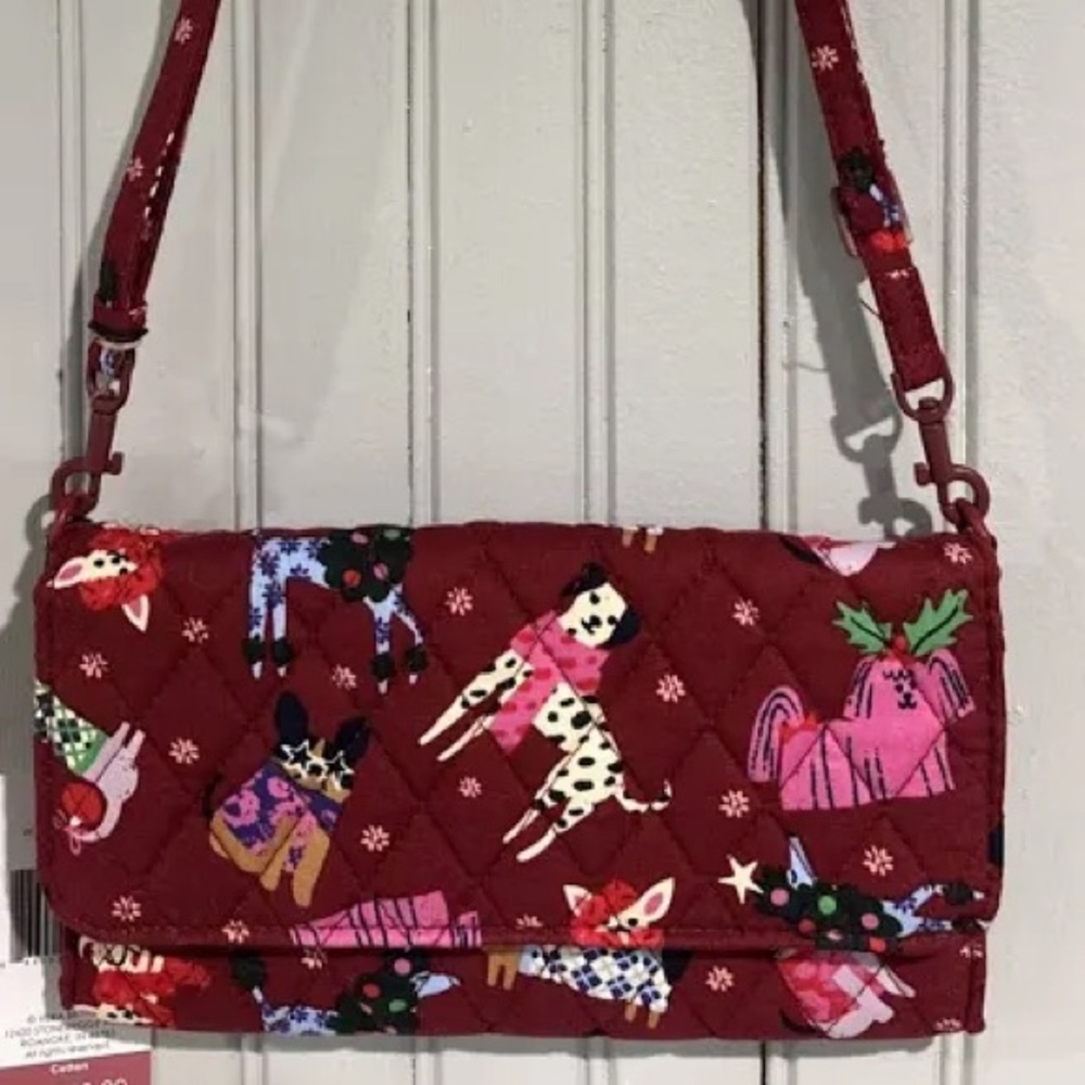 New with tag. Vera Bradley Quilted Burgundy Crossbody Wallet.